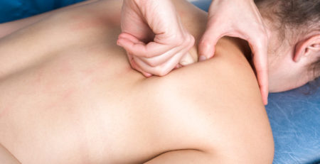 osteopath massaging back